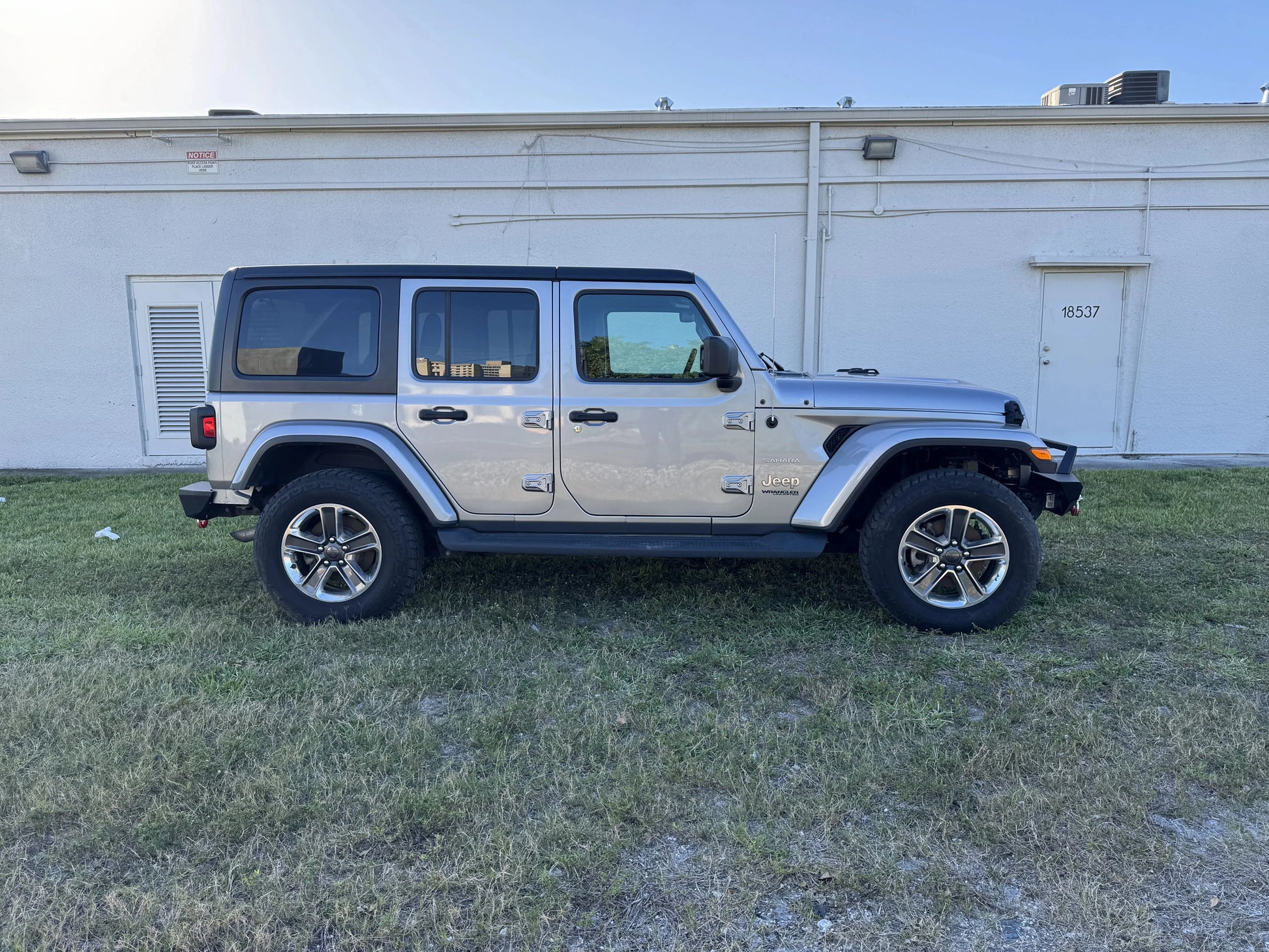 2020 Jeep Wrangler Sahara on display, available as a repairable and salvage car for sale from Salvage Car Deal