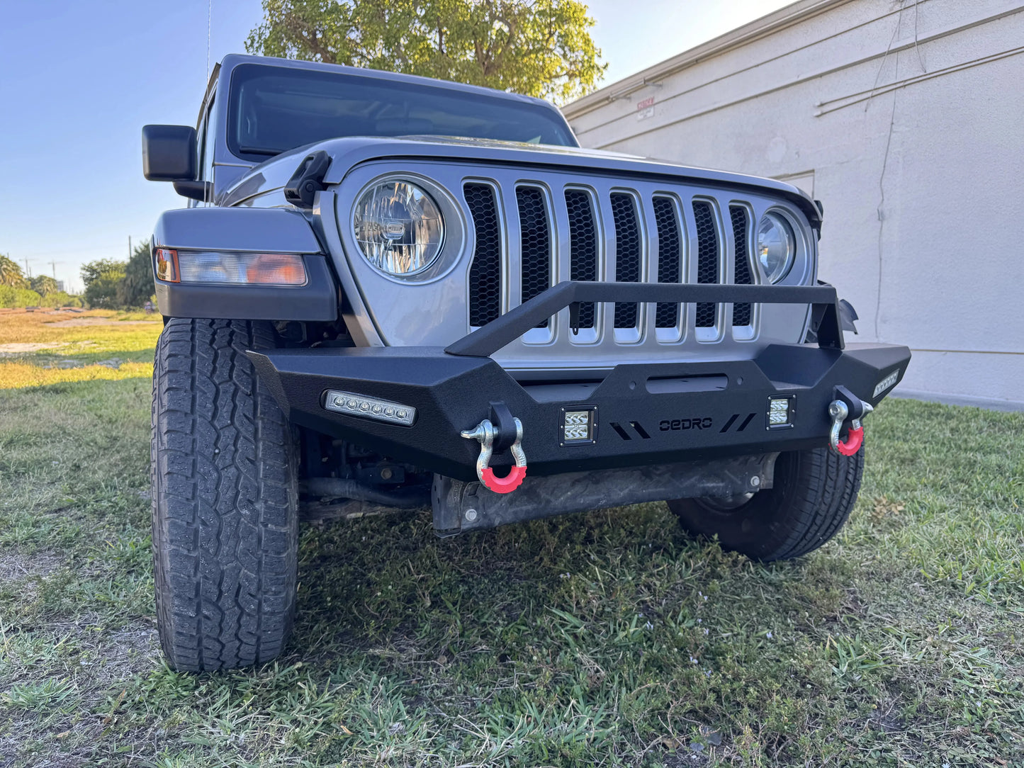 2020 Jeep Wrangler Sahara with an upgraded front bumper and LED lights, available as a repairable & salvage car for sale